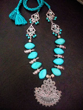 Woven Whispers - Howlite Turquoise Necklace with Peacock Pendant