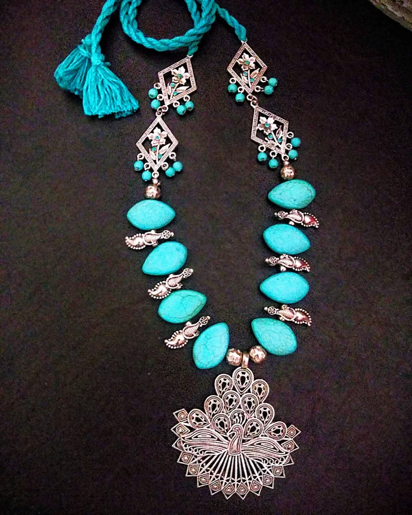 Woven Whispers - Howlite Turquoise Necklace with Peacock Pendant